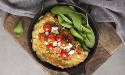 omelette-with-cheese-tomatoes-cutting-board